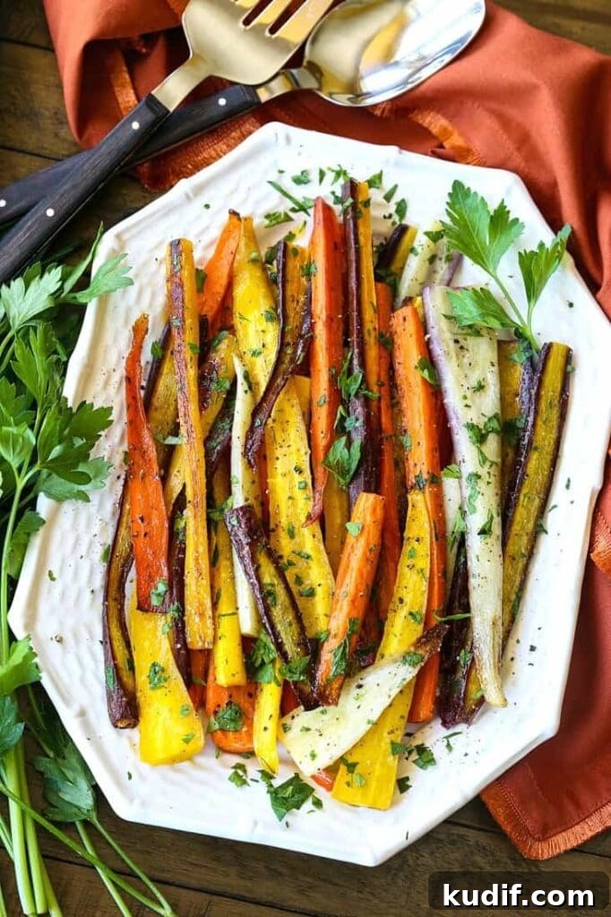 Roasted carrots with parsley on a white platter