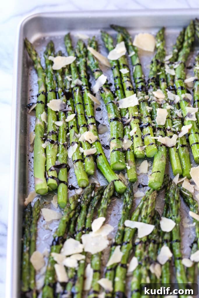 roasted asparagus drizzled with balsamic glaze and parmesan cheese