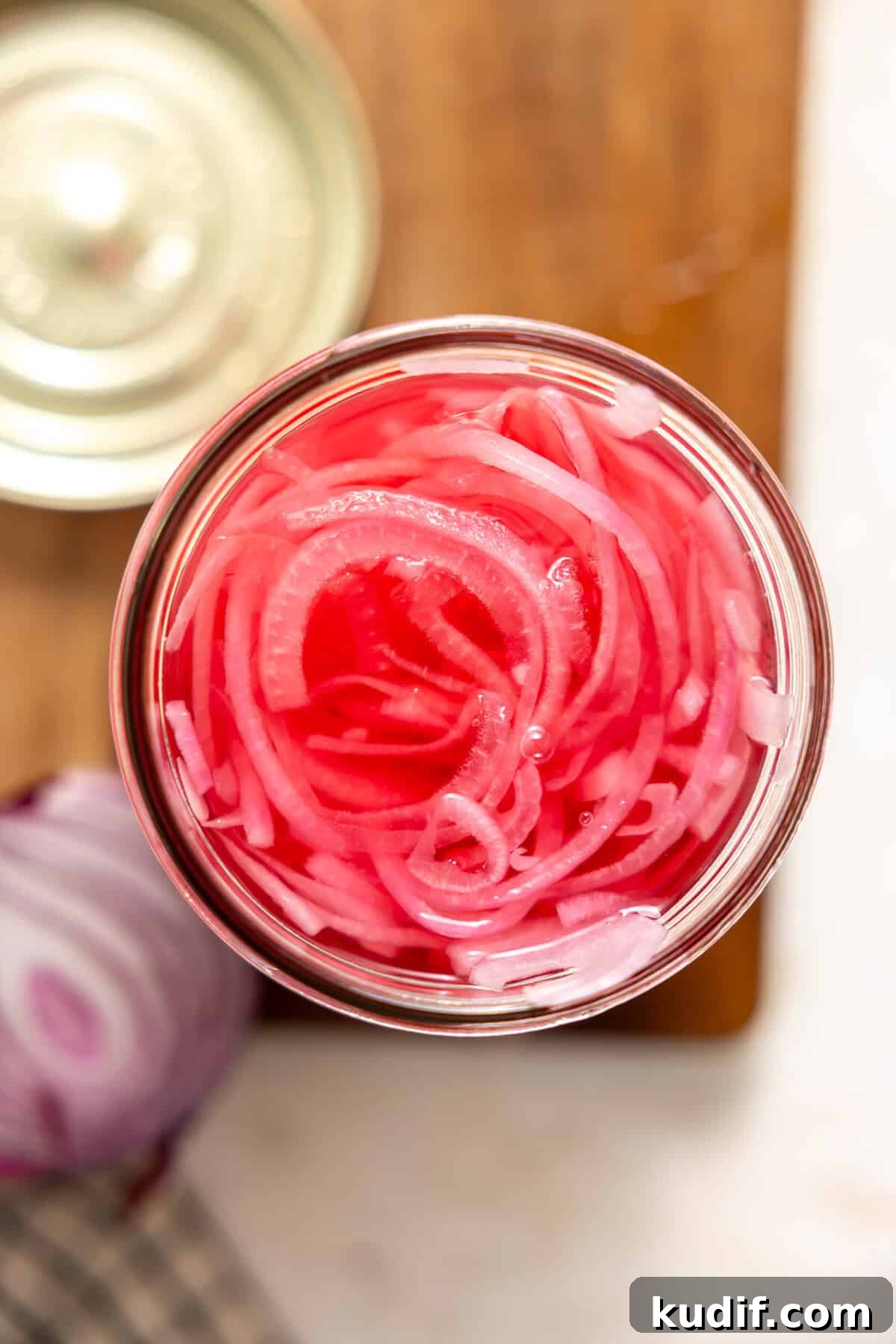 Quick Pickled Red Onions Recipe for Salads & Sandwiches 9 Overhead look at pickled red onions in a jar.