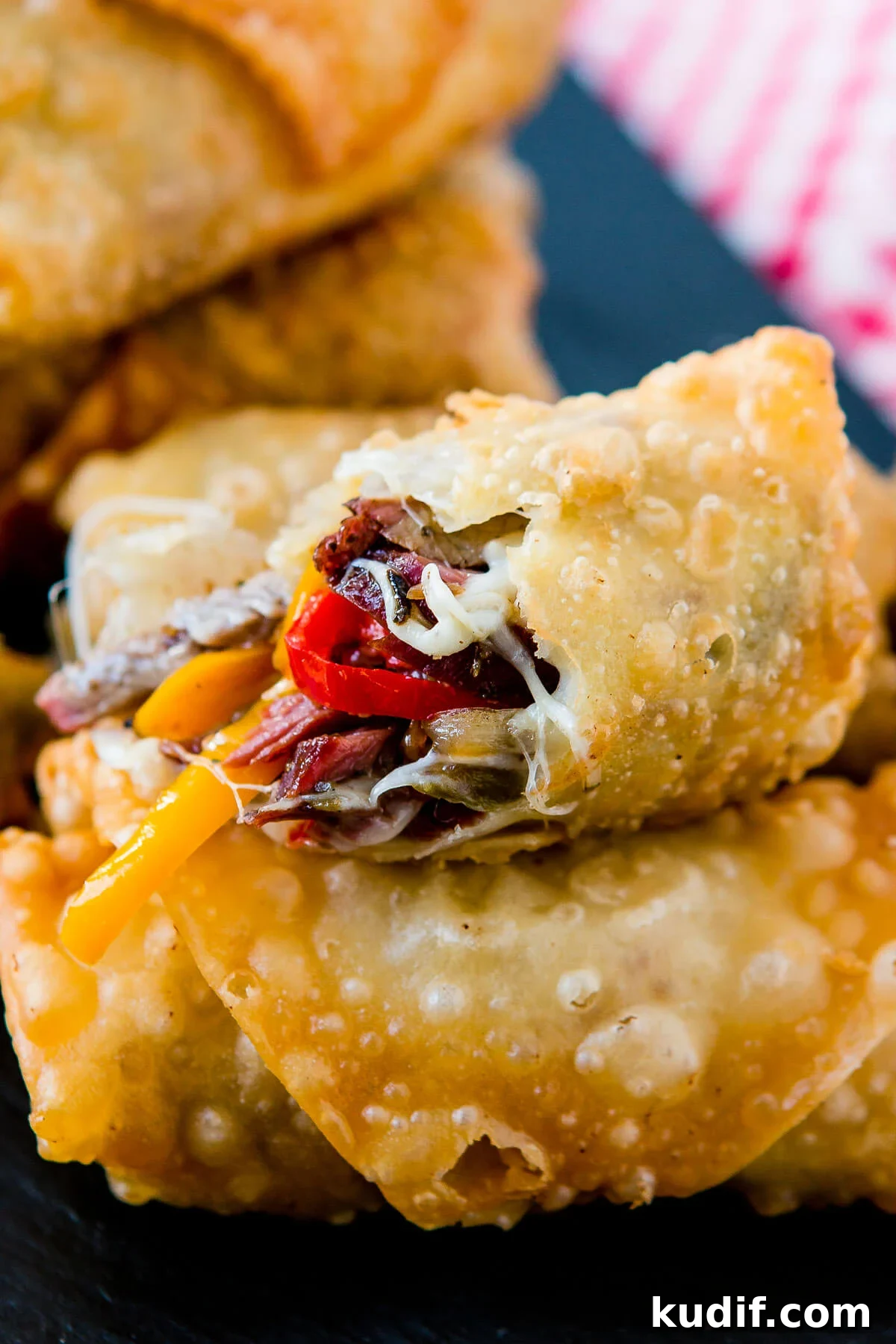 Who wouldn't love a crisp, fried egg roll full of meat and cheese? These Philly Cheesesteak Egg Rolls are perfect for football games and parties! ohsweetbasil.com