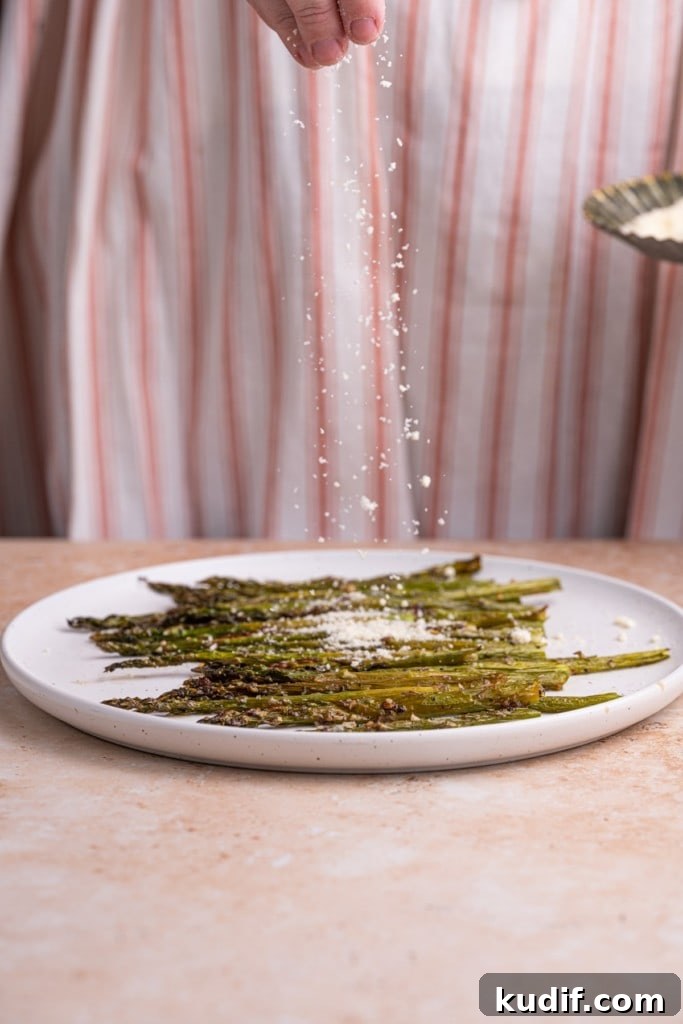 20-Minute Garlic Lemon Asparagus Recipe for Quick Weeknight Sides 7 Sprinkling Garlic Lemon Asparagus with Parmesan.