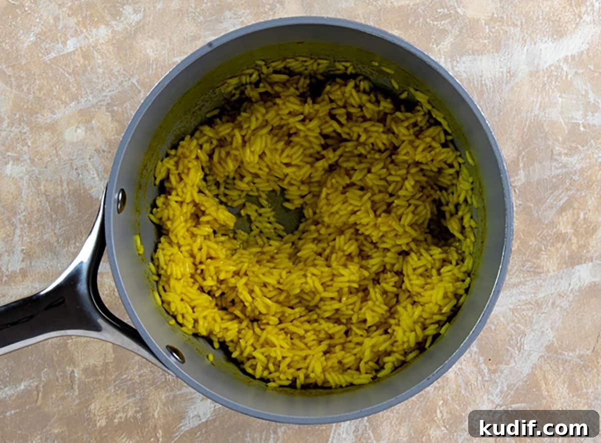 Cheesy Corn and Rice Casserole with Bacon and Green Chiles 4 Cooked yellow rice in small pot.