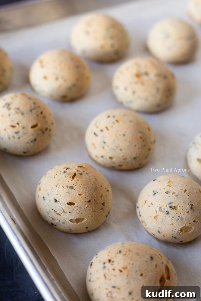 Korean Mochi Bread Recipe: Chewy, Crispy Toasted Rice Cake Guide 3 Angled view of Korean mochi breads on a sheet pan.