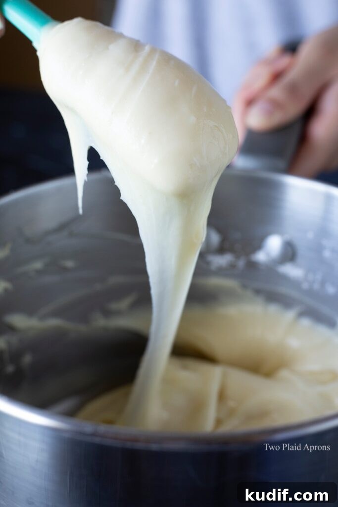 Korean Mochi Bread Recipe: Chewy, Crispy Toasted Rice Cake Guide 7 Showing the consistency of the dough after adding the egg and ready to use.