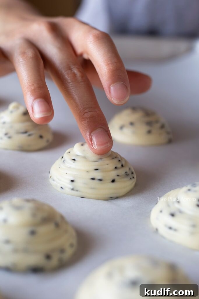 Korean Mochi Bread Recipe: Chewy, Crispy Toasted Rice Cake Guide 9 Dabbing the tips of each mount of dough with cold water.