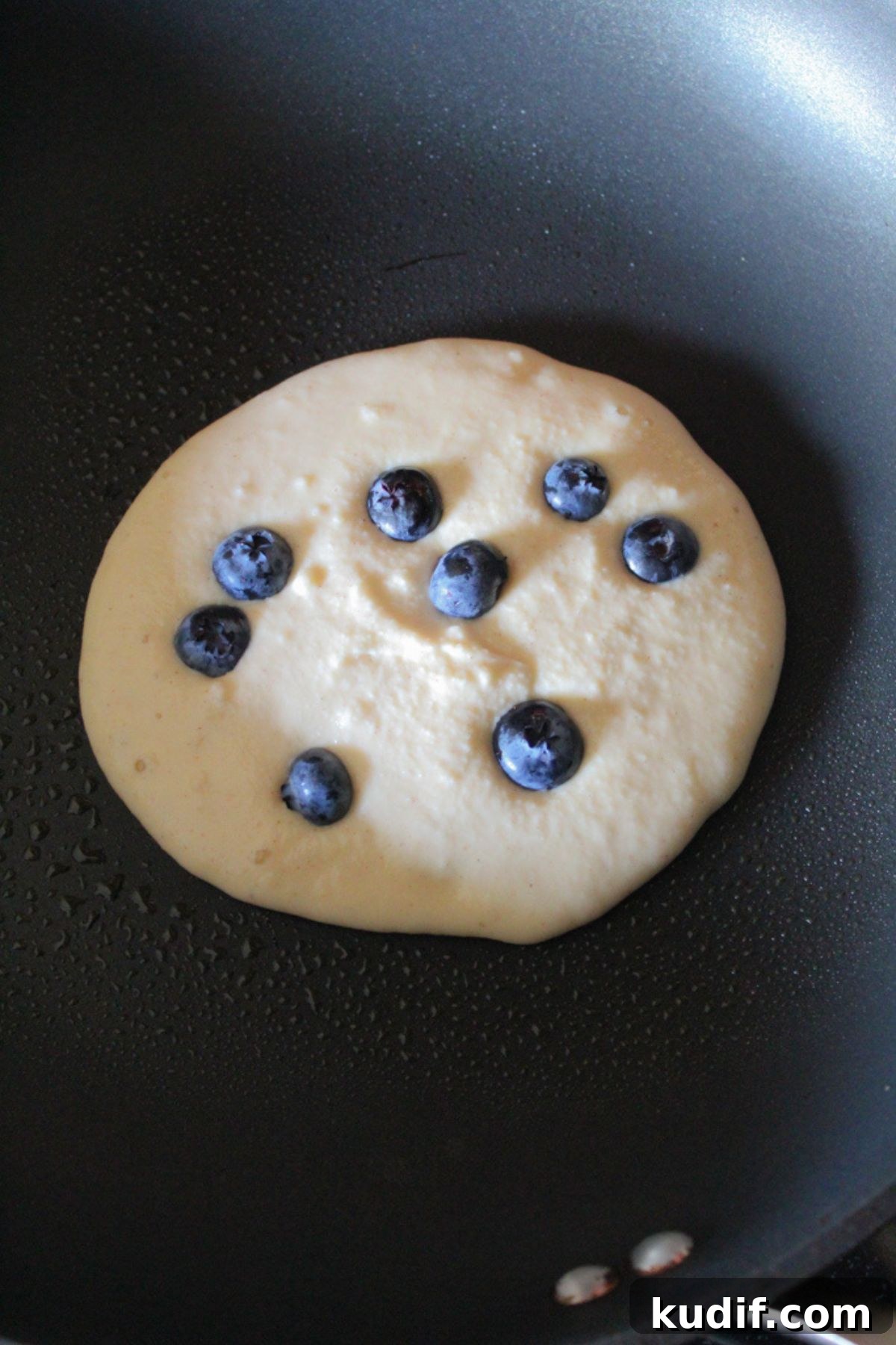 Gluten-Free Blueberry Pancake Recipe That Flips Perfectly 6 pancake portioned in a skillet