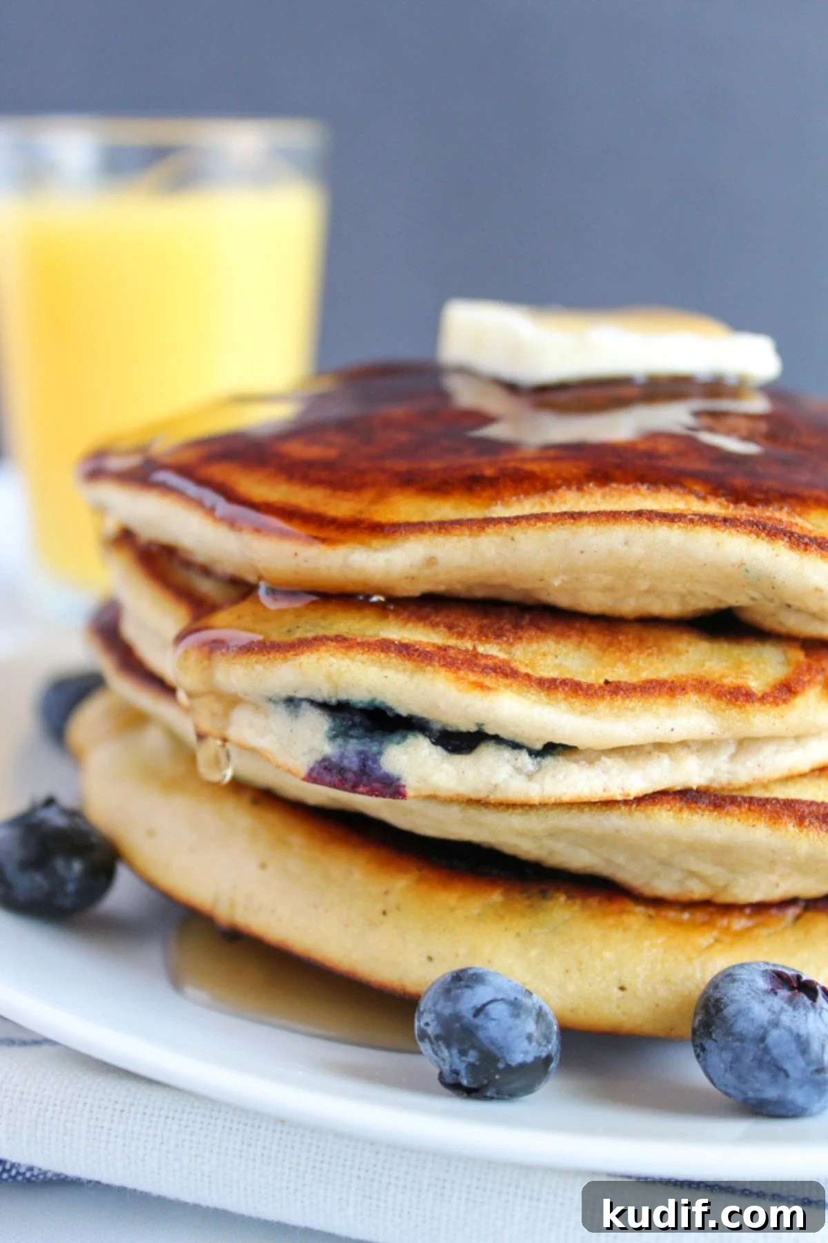Gluten-Free Blueberry Pancake Recipe That Flips Perfectly 8 stack of pancakes on a plate