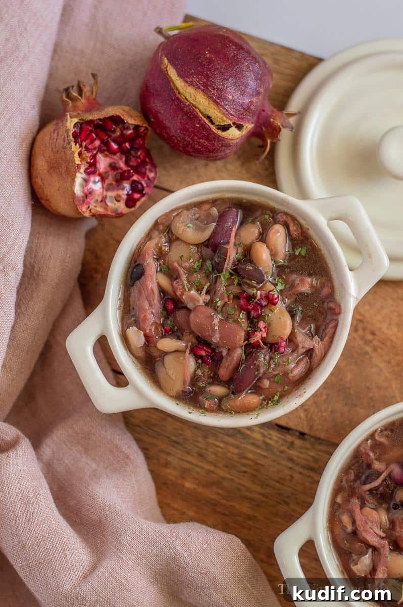 40+ Thanksgiving Dishes That Start with S: Sides, Staples & Sweets 4 Slow cooker ham and bean soup in a bowl with pomegranate