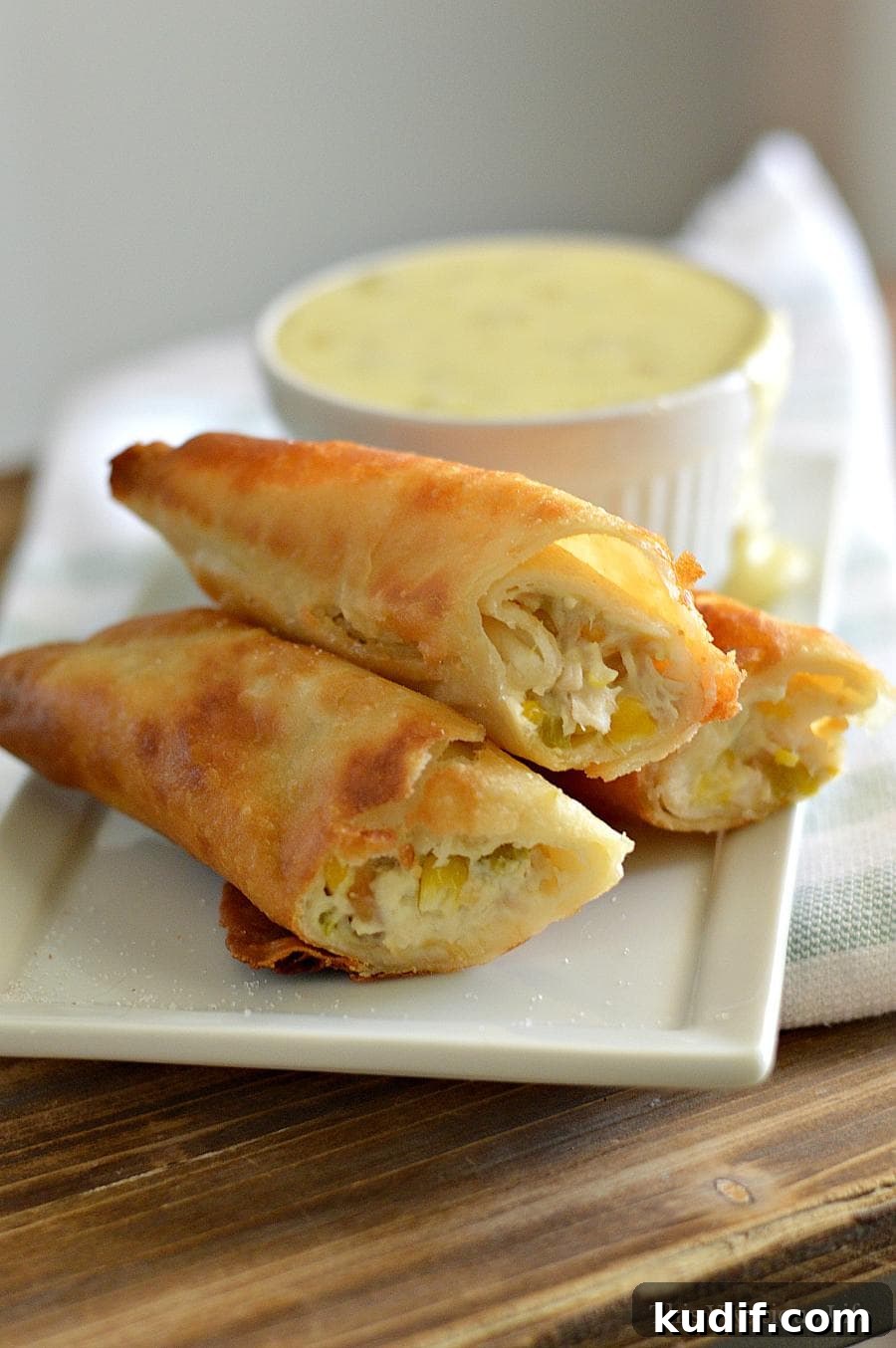 40+ Thanksgiving Dishes That Start with S: Sides, Staples & Sweets 6 Rolled Tacos on a plate with queso