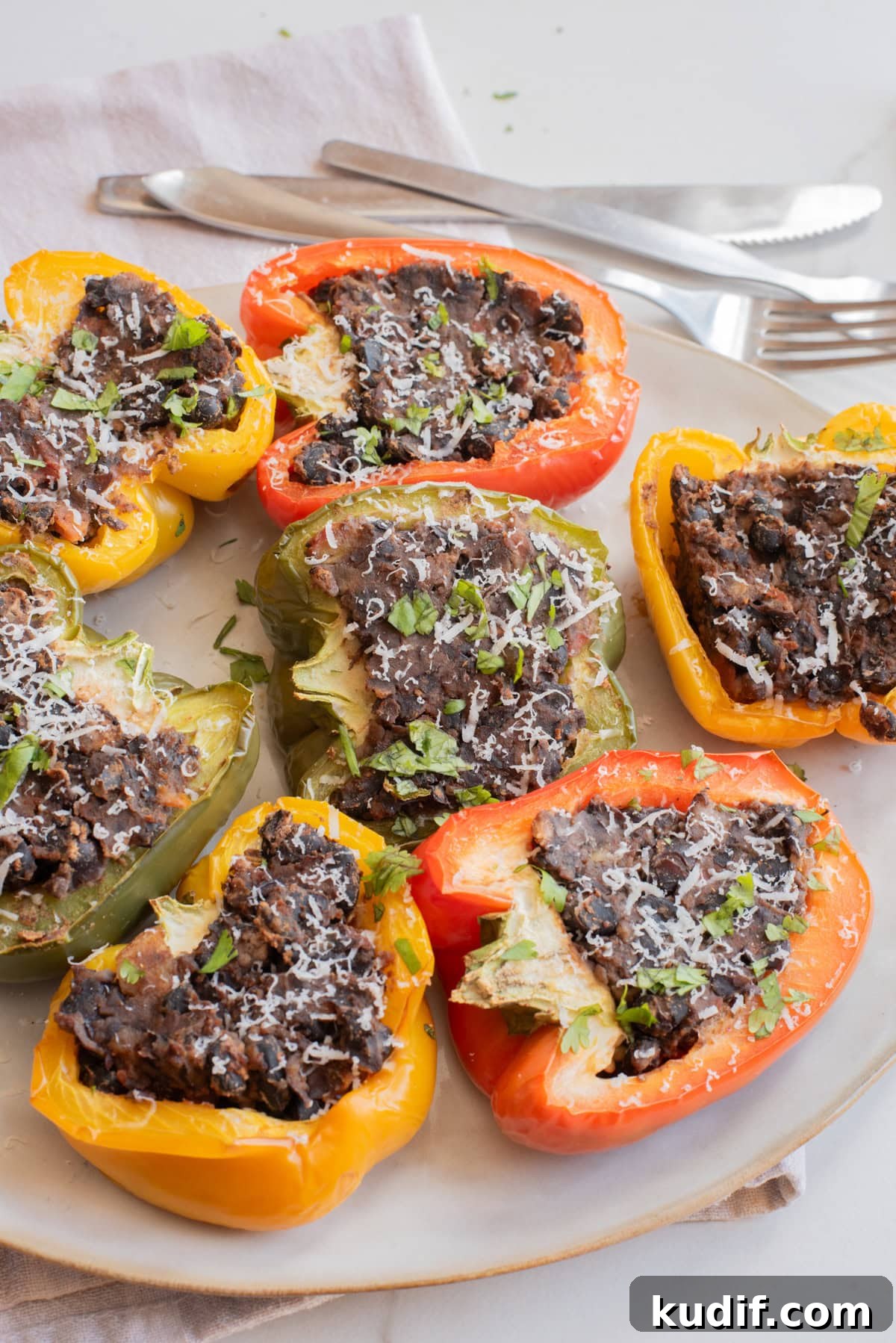Smoky Black Bean Stuffed Peppers with Cilantro Lime Rice 2 Close-up image of a plate black bean stuffed peppers.