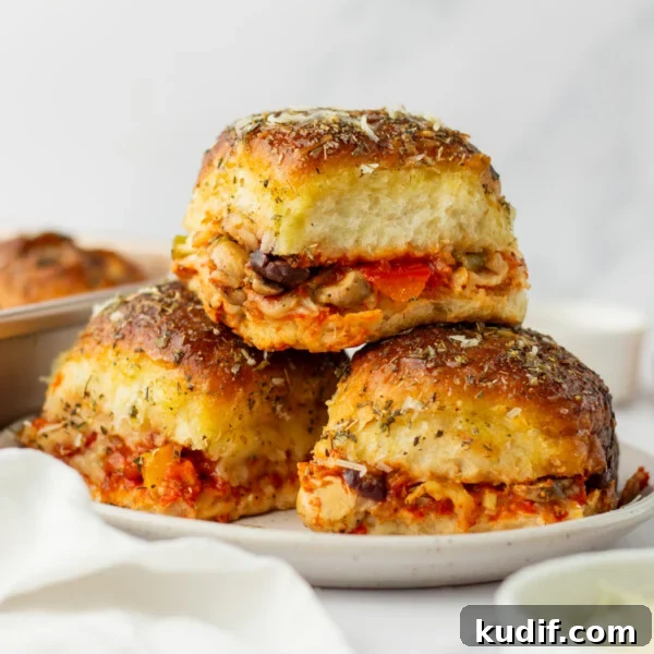 Smoky Black Bean Stuffed Peppers with Cilantro Lime Rice 14 An image of a stack of pizza sliders on a plate.