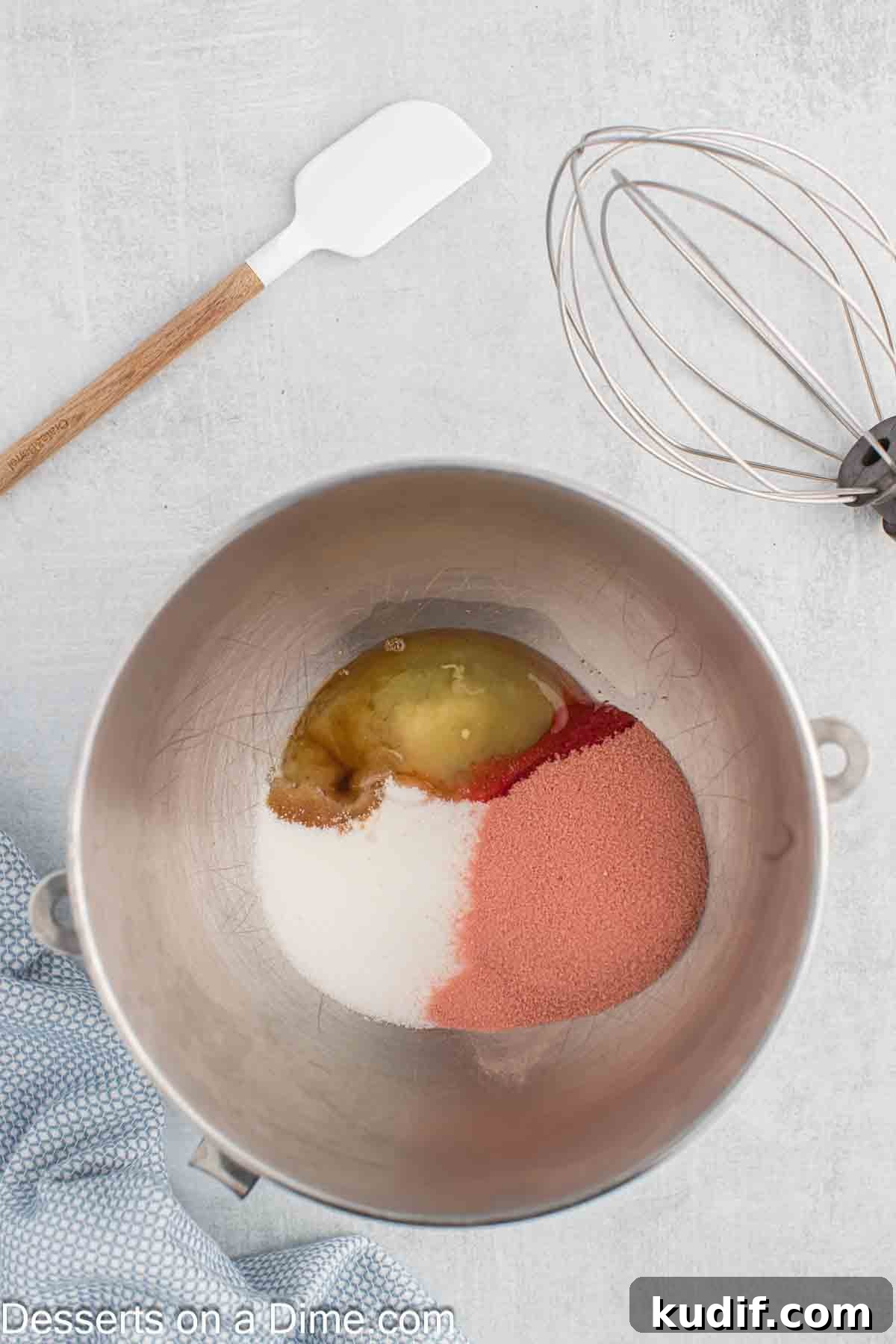 Gelatin Frosting Recipe: Smooth, Vibrant Jello Icing Ideas 4 Bowl with jelllo mixture, sugar, eggs, vanilla.
