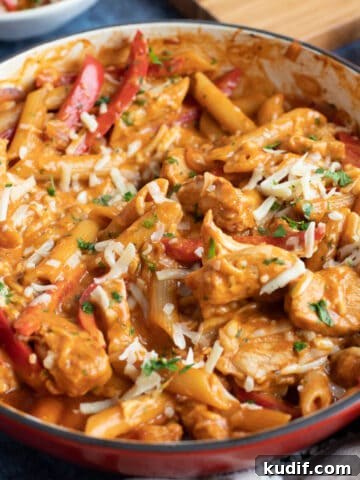 A pan of creamy bbq chicken pasta.