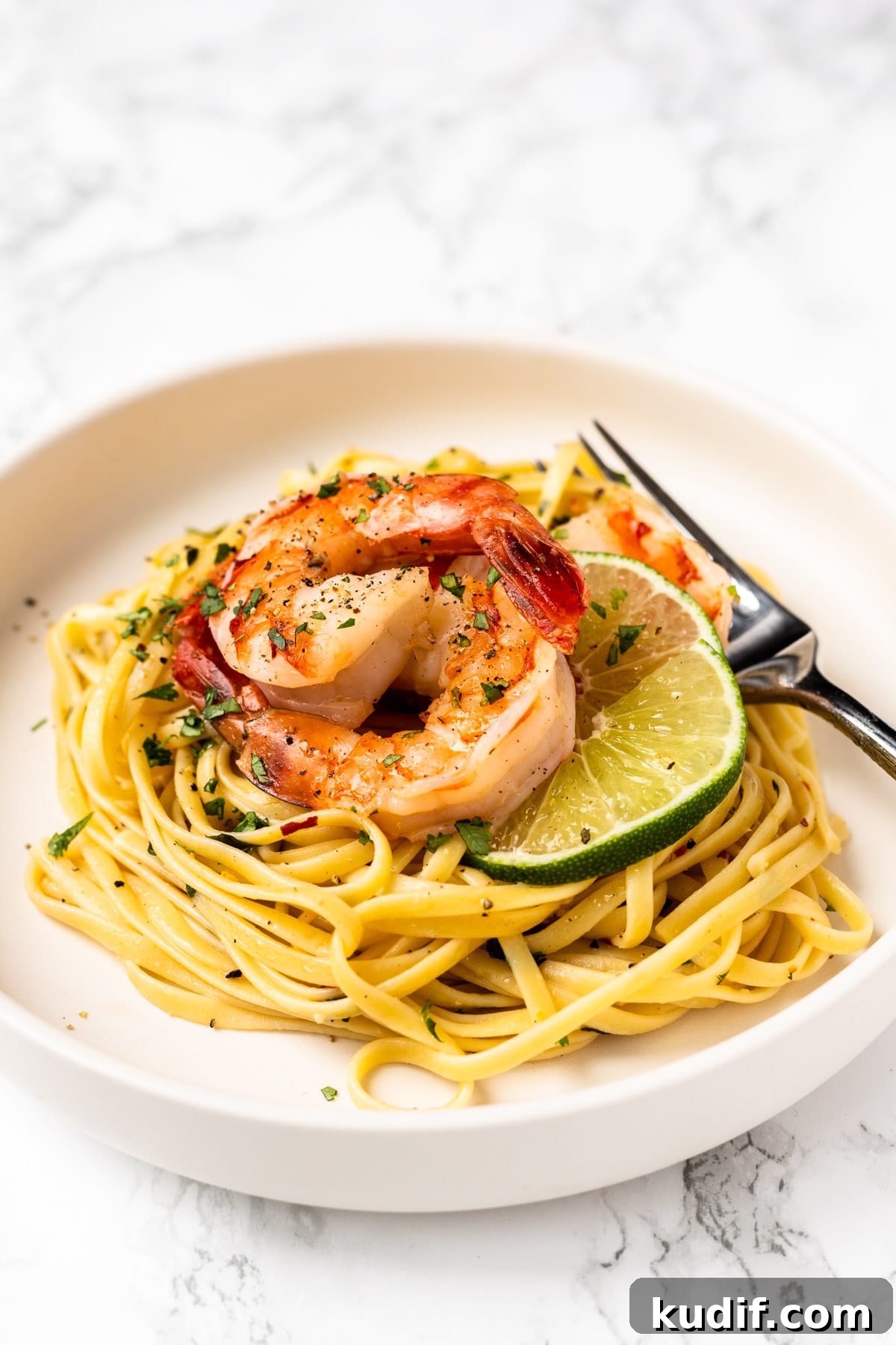 Cilantro-Lime Shrimp Pasta with Garlic and Parmesan 6 A sideview of a bowl of cilantro lime shrimp pasta.