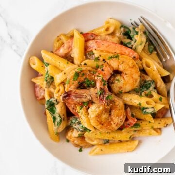 a top down view of a bowl of cajun shrimp pasta