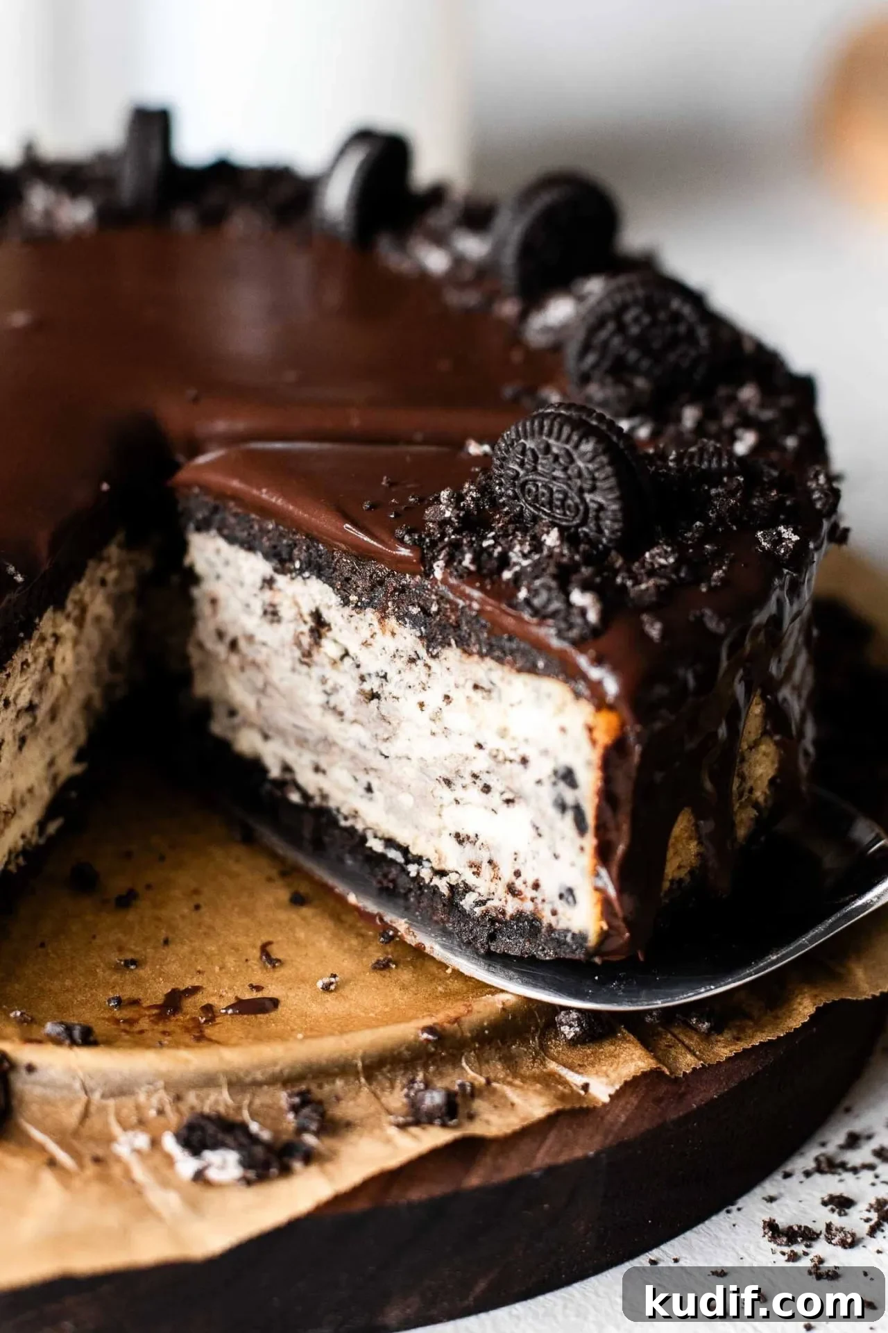 Oreo Cheesecake Recipe: Creamy No-Bake Dessert with Oreo Crust 3 sliced Oreo cheesecake on serving board