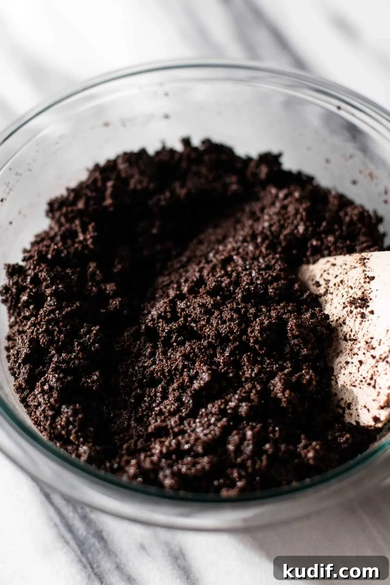 Oreo Cheesecake Recipe: Creamy No-Bake Dessert with Oreo Crust 4 Oreo cheesecake crust mixture in bowl