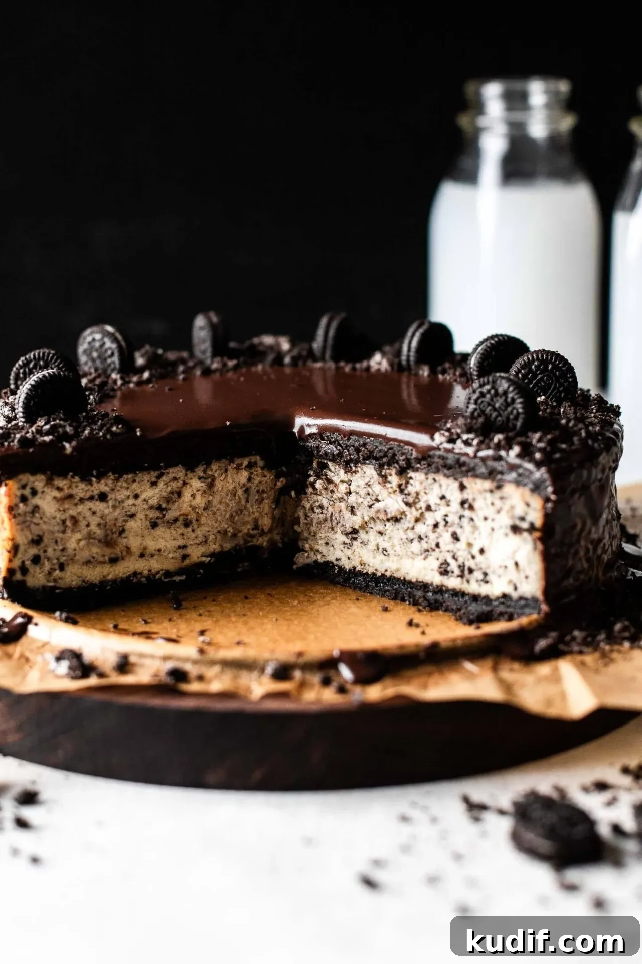 Oreo Cheesecake Recipe: Creamy No-Bake Dessert with Oreo Crust 10 sliced Oreo cheesecake on serving board