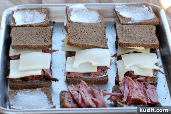 Slow Cooker Corned Beef Recipe for Tender, Flavorful Results 7 corned beef sandwiches on a baking sheet