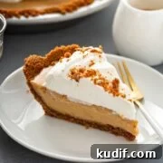 fluffy butterscotch pie slice served on a white plate with a fork