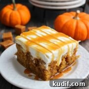 a slice of pumpkin caramel poke cake