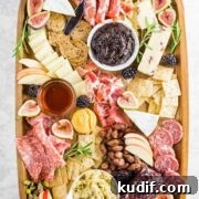 a charcuterie harvest board served with dips