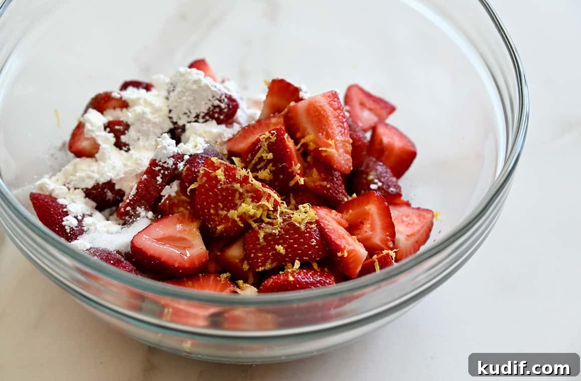 Puff Pastry Galette Recipe: Step-by-Step Fruit and Savory Ideas 4 Sliced strawberries, lemon zest, sugar and cornstarch in a clear bowl