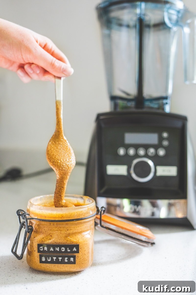 Homemade Granola Butter: Creamy Spread Made from Toasted Granola 3 Vegan Granola Butter next to a vitamix - Georgie Eats