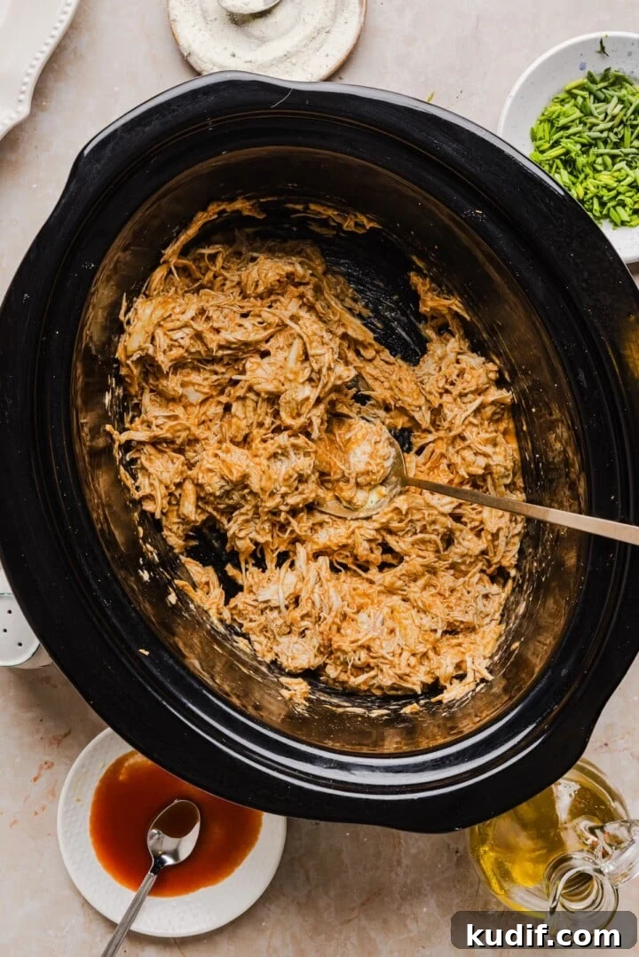 Buffalo Chicken Stuffed Sweet Potatoes Recipe for Spicy Weeknight Meals 6 Creamy shredded buffalo chicken for easy weeknight dinner recipe using slow cooker.