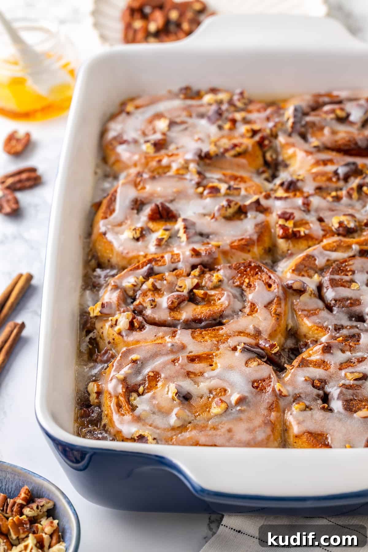 This vegan cinnamon roll French toast recipe has soft homemade cinnamon rolls baked in custard. The best cozy breakfast or holiday brunch! Baking dish of cinnamon roll French toast