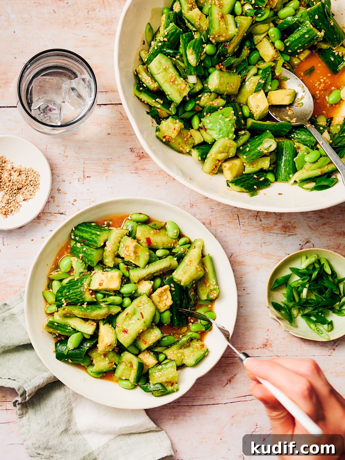 Spicy Cucumber Salad Recipe: Quick Tangy Side Dish 13 Spicy Cucumber Salad being served at the dinner table.
