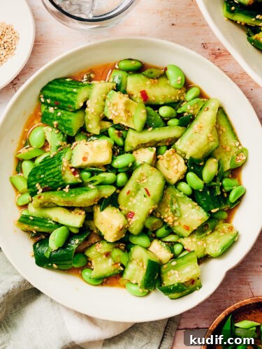 Spicy Cucumber Salad Recipe: Quick Tangy Side Dish 16 Easy Spicy Cucumber Salad with edamame and avocado in a serving bowl.