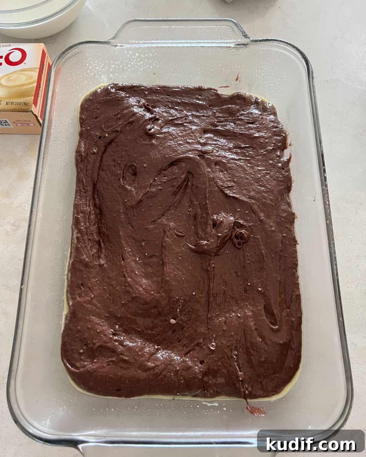 Decadent Pudding Cake Recipe (Even Better Than Sex Cake) 4 Chocolate cake mix and diet soda mix in a pan.