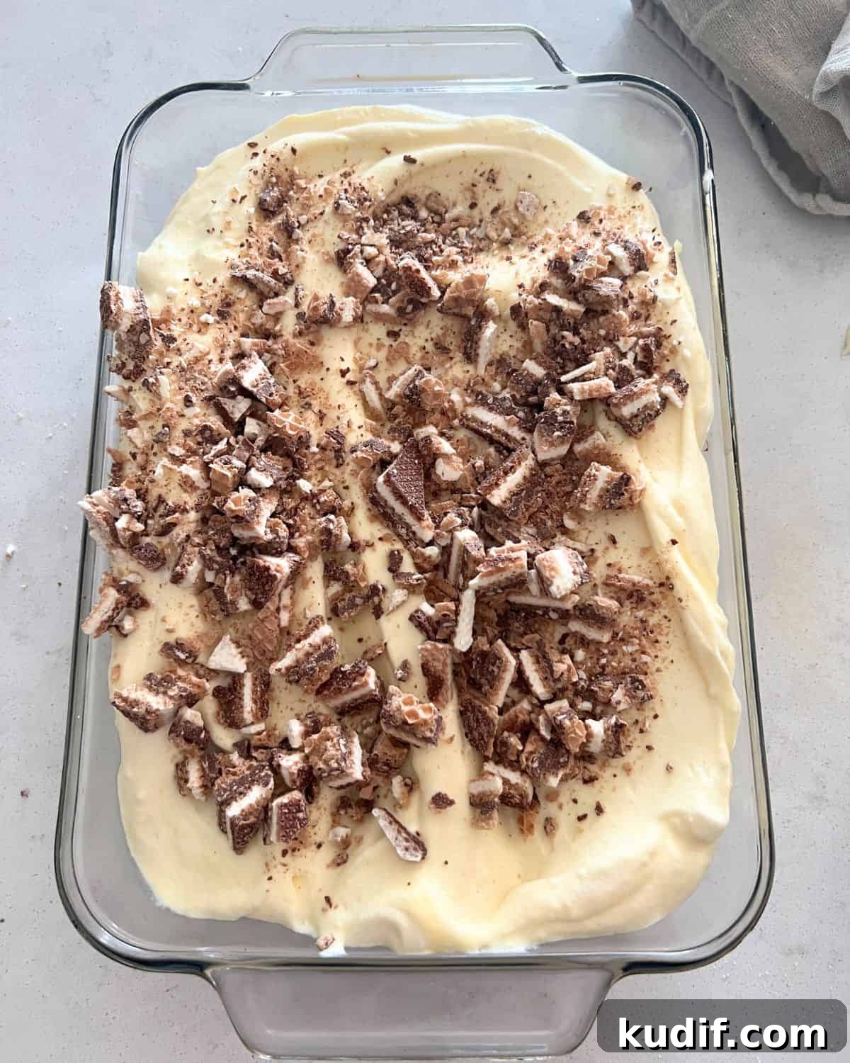 Decadent Pudding Cake Recipe (Even Better Than Sex Cake) 6 Better than sex cake topped with the frosting and cut cup candy bars.