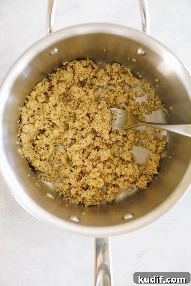 Quinoa-Stuffed Bell Peppers with Savory Tomato Filling 4 cooked white quinoa in a pot