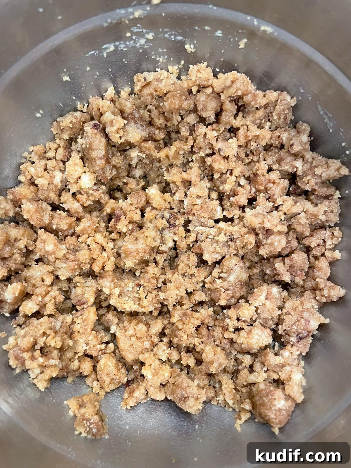Spiced Apple Crumb Cake Recipe with Cinnamon Streusel 5 overhead shot of crumb topping in mixing bowl.
