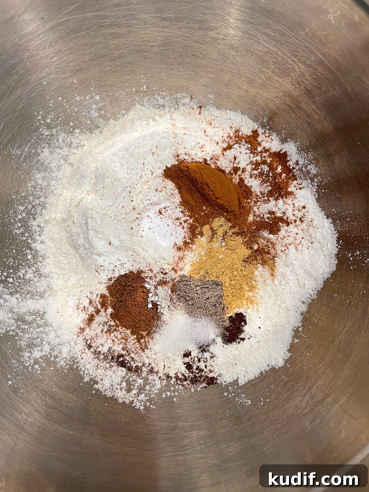 Spiced Apple Crumb Cake Recipe with Cinnamon Streusel 6 overhead shot of dry cake ingredients in mixing bowl.