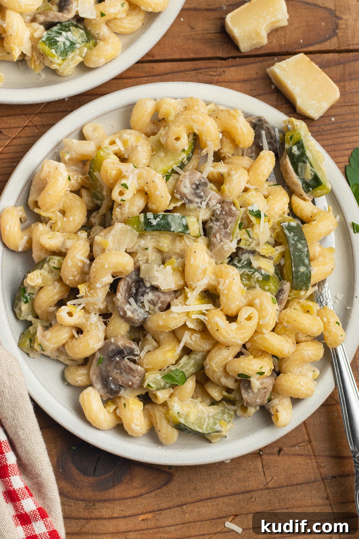 Zucchini, Mushroom & Leek Pasta Recipe — Creamy Spring Pasta 2 This is a picture of a plate with zucchini mushroom pasta.