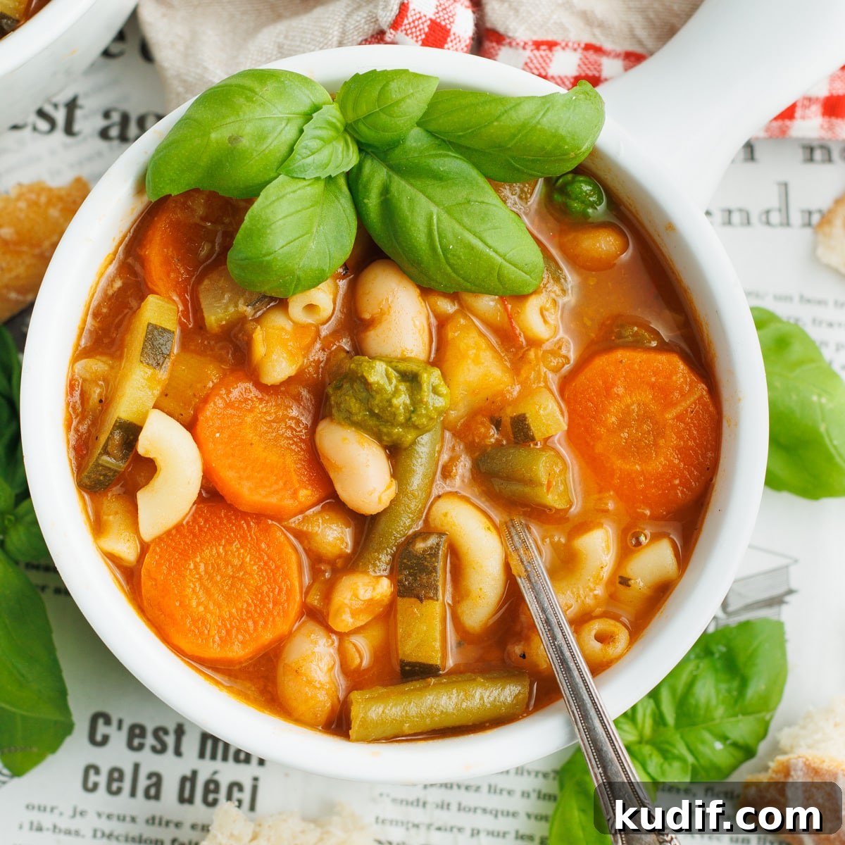 Picture of a white bowl filled with soupe au pistou.