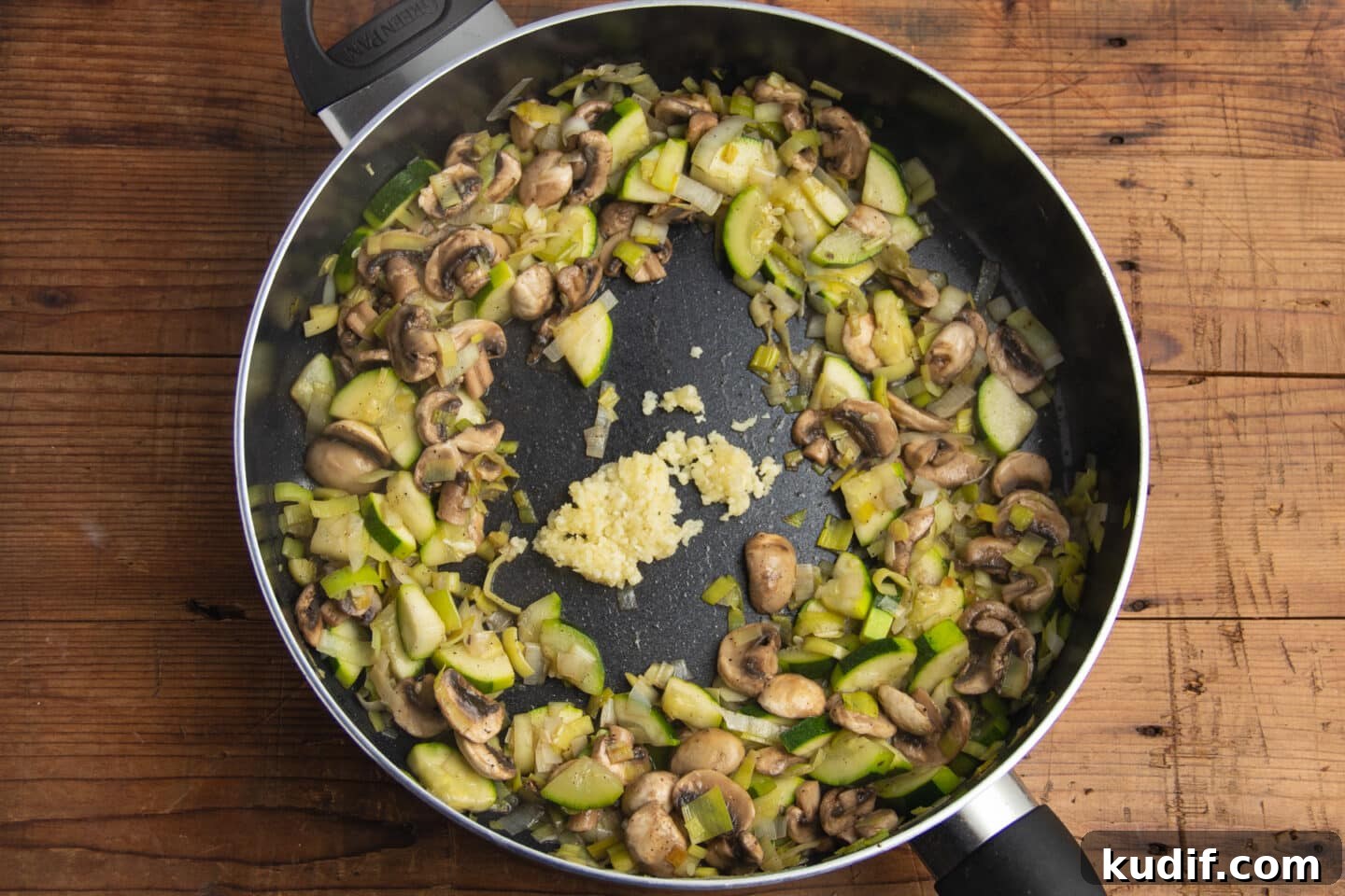 Zucchini, Mushroom & Leek Pasta Recipe — Creamy Spring Pasta 6 This is a picture of the skillet full of veggies with added garlic.