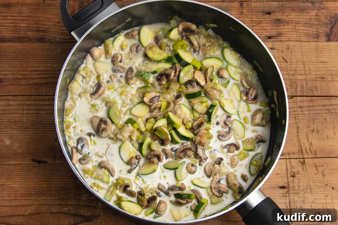 Zucchini, Mushroom & Leek Pasta Recipe — Creamy Spring Pasta 7 This is a picture of the skillet with the broth and half and half added.