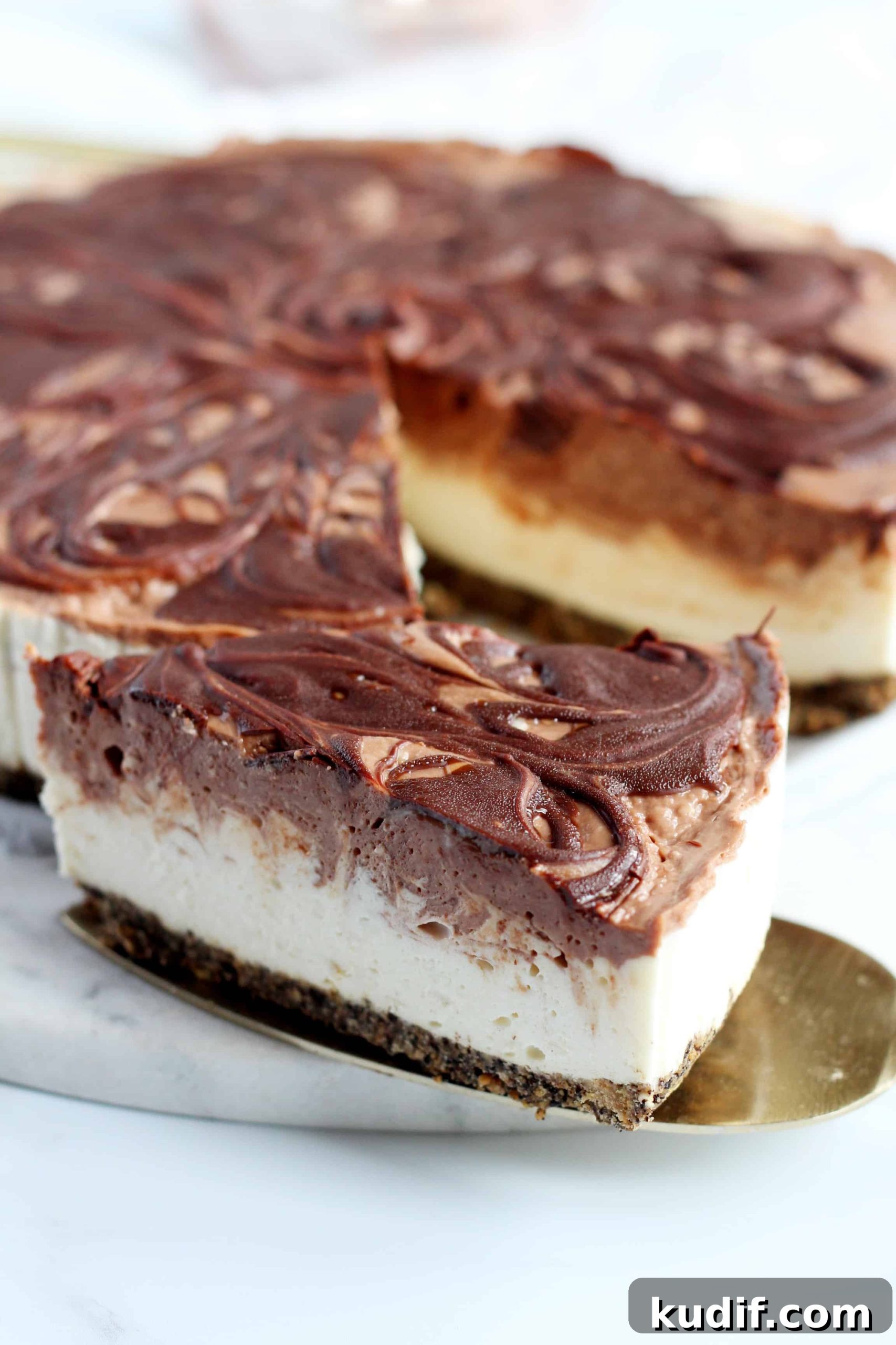 Nutella  Cheesecake slice close up on golden slicer