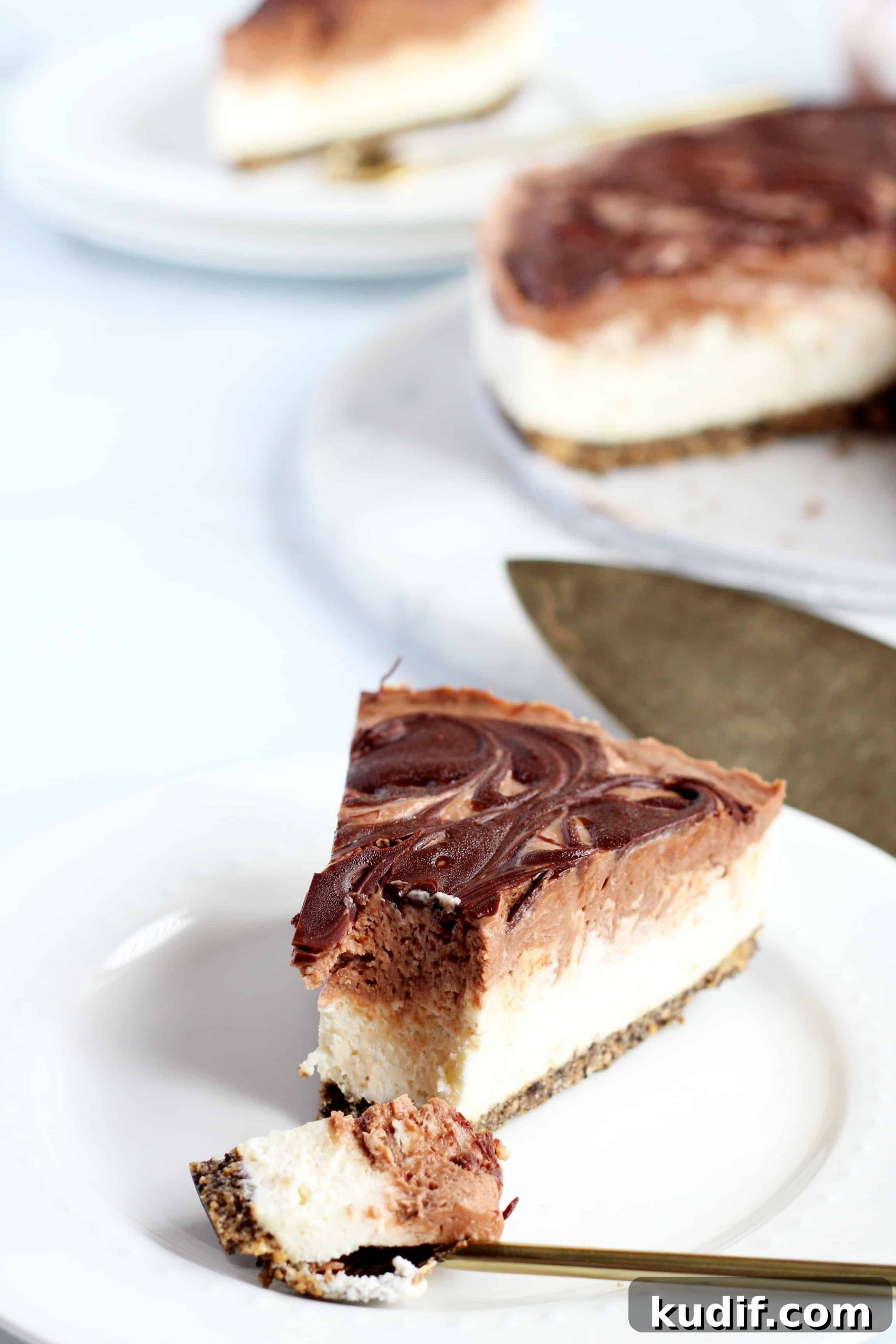Nutella cheesecake slice with bite portion on spoon