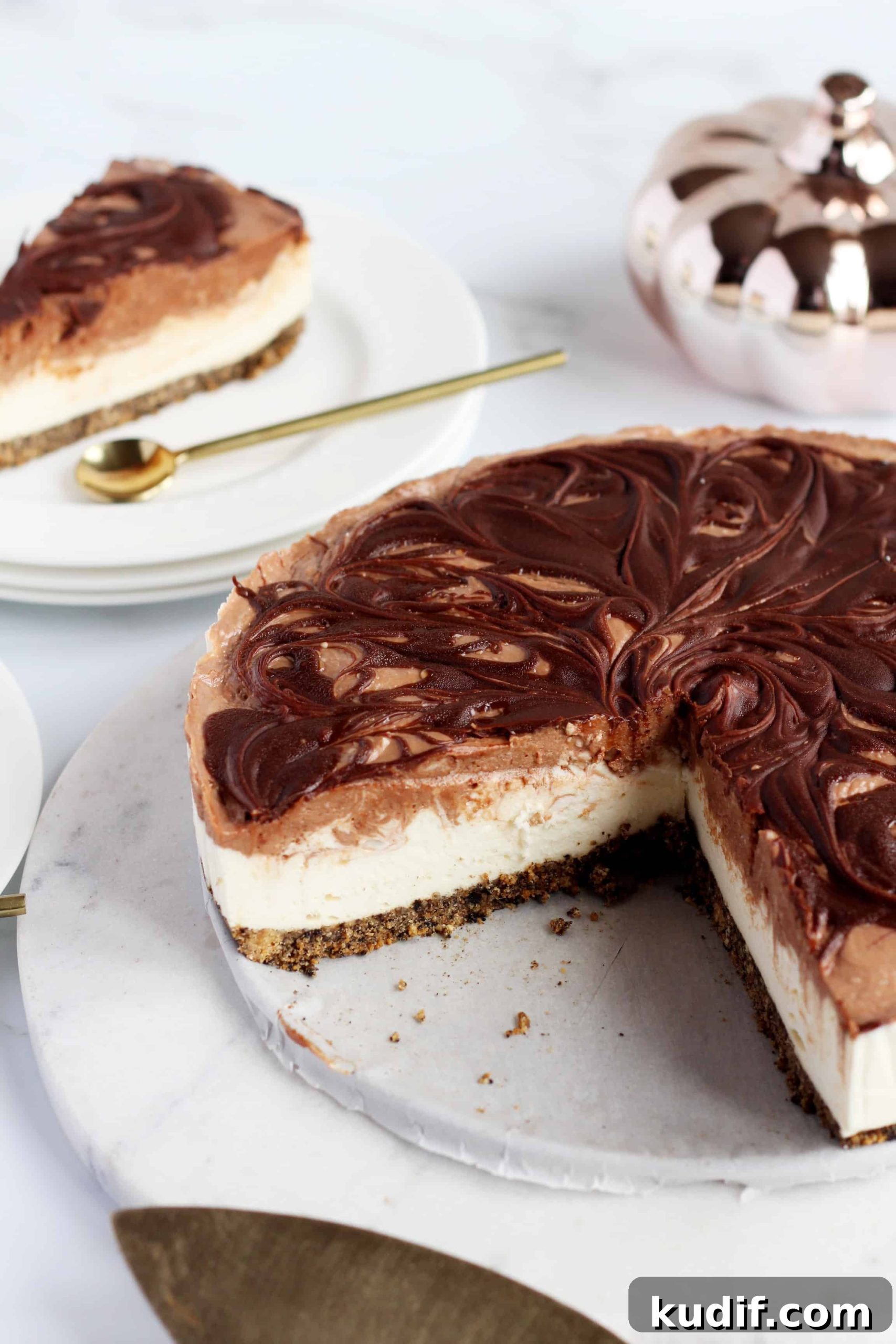 the whole chocolate swirl Cheesecake on marble plate