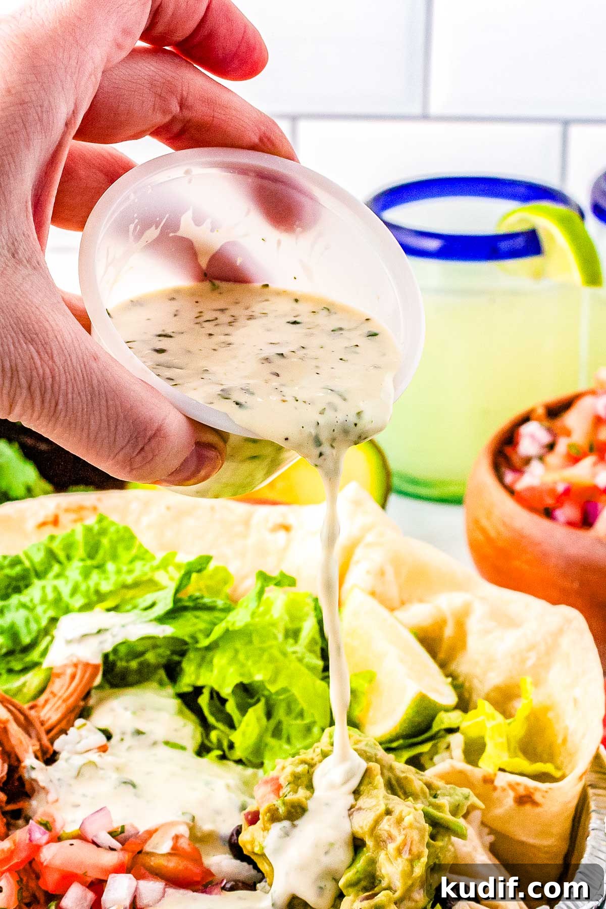 Cafe Rio Cilantro Lime Dressing Recipe (Copycat) 5 Cilantro Lime Dressing poured over a salad.