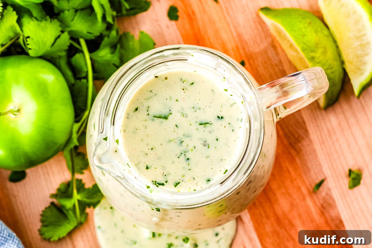 Cafe Rio Cilantro Lime Dressing Recipe (Copycat) 6 An overhead of Cafe Rio salad dressing in a small dressing container.