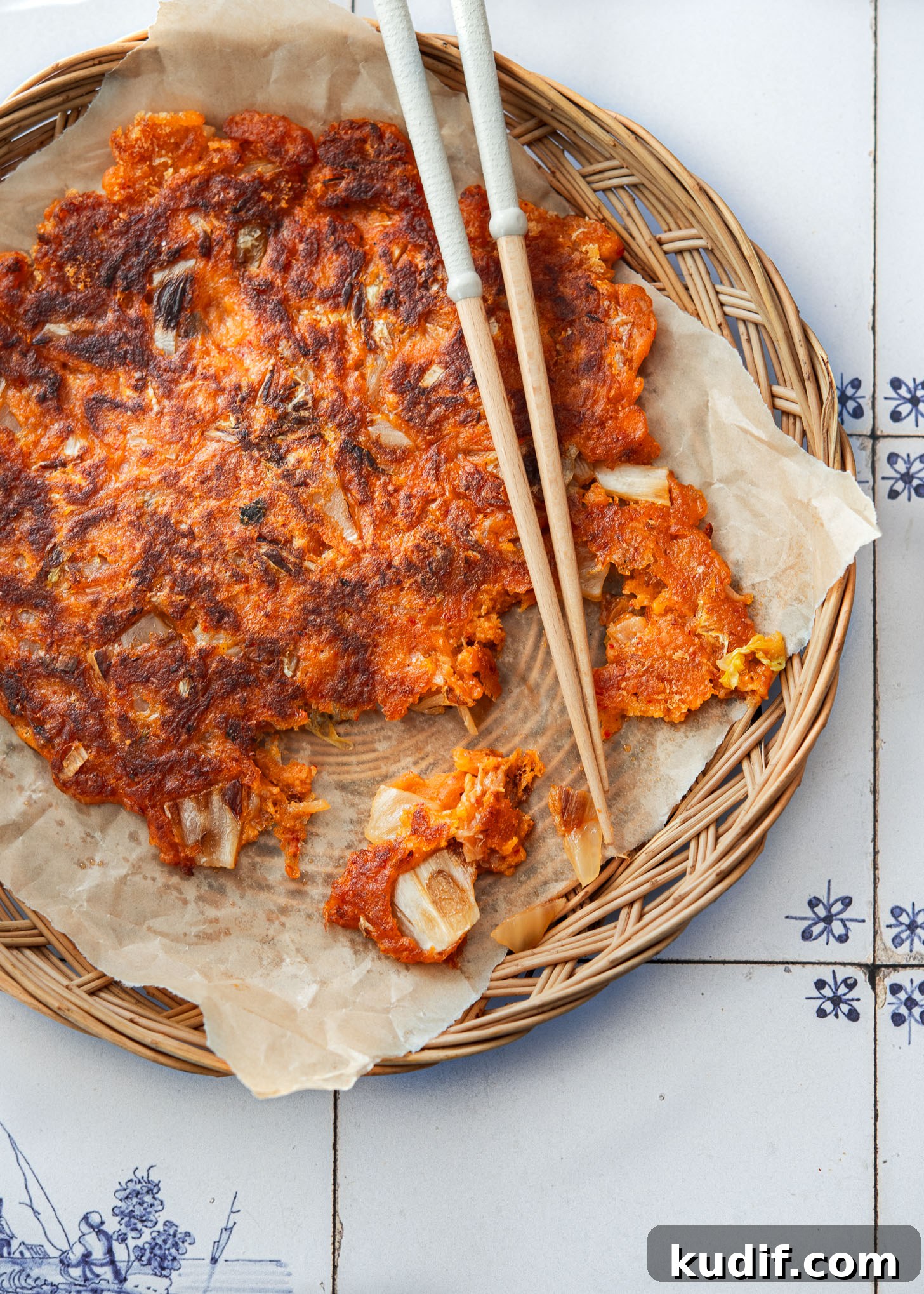 Crispy Kimchi Pancakes (Kimchi Jeon) Recipe for Perfect Pan-Fried Kimchi Cakes 12 Crispy kimchi pancakes (kimchi jeon or kimchi buchimgae) picked up with chopsticks.