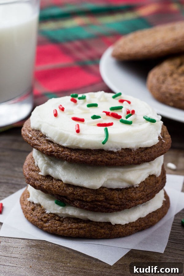 These easy gingerbread cookies are soft, chewy & perfect for the holidays. It's a no chill recipe - so they take way less time to make than regular gingerbread cookies. Then they're topped with fluffy cream cheese frosting.