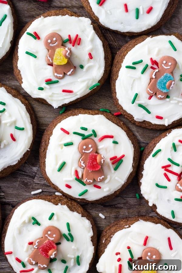 These easy gingerbread cookies are soft, chewy & perfect for the holidays. It's a no chill recipe - so they take way less time to make than regular gingerbread cookies. Then they're topped with fluffy cream cheese frosting.