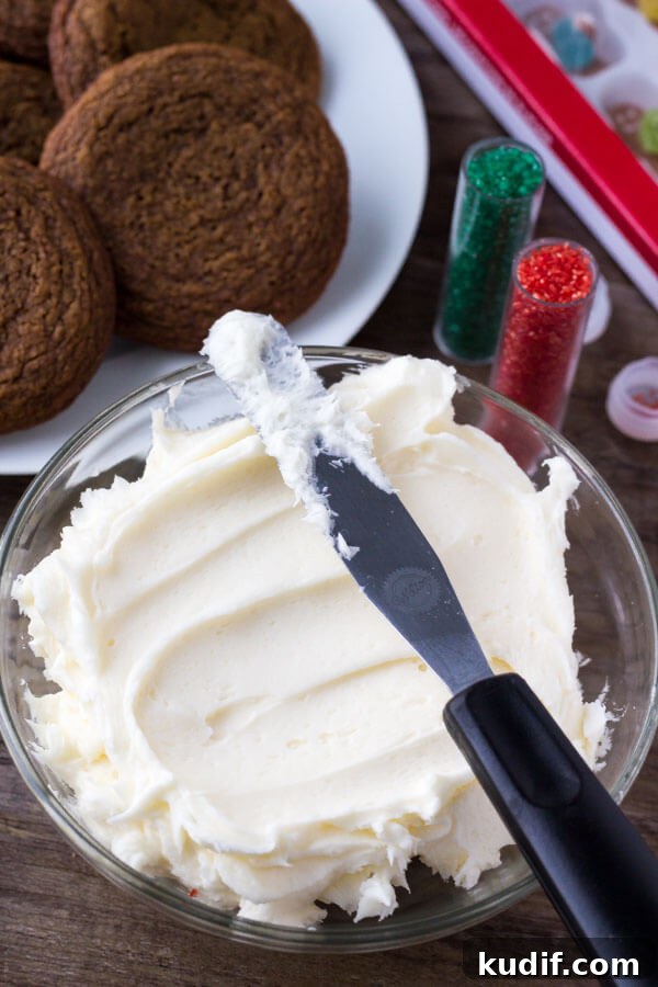 These easy gingerbread cookies are soft, chewy & perfect for the holidays. It's a no chill recipe - so they take way less time to make than regular gingerbread cookies. Then they're topped with fluffy cream cheese frosting.